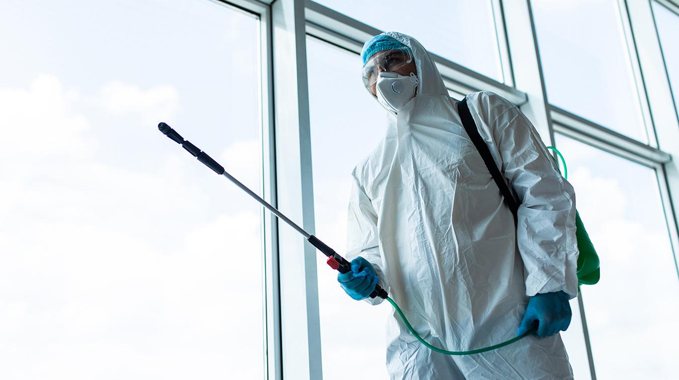Professional Sanitising QCS Staff Pressure Cleaning | Featured Image for the Commercial Pressure Cleaning Page of QCS Cleaning